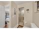 Bathroom with a glass-enclosed shower stall, a toilet, and neutral wall paint at 11008 Waterford Ave, Englewood, FL 34224