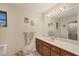 Well-lit bathroom with double sink vanity and shower stall at 11008 Waterford Ave, Englewood, FL 34224