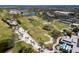 Golf course and lakes in community featuring tennis courts, clubhouse, and well-maintained green spaces at 11125 Mcdermott Ct, Englewood, FL 34223