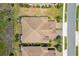 Aerial view of home showcasing the roof, landscaping, and proximity to the street at 11125 Mcdermott Ct, Englewood, FL 34223