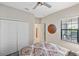 Primary bedroom featuring a neutral color scheme and ample natural light at 11125 Mcdermott Ct, Englewood, FL 34223