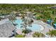 Lush landscaping surrounds the community pool, creating a tropical paradise for relaxation and leisure at 11125 Mcdermott Ct, Englewood, FL 34223