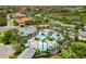 Aerial view showcasing the large pool and lush landscape of the community amenity center at 11125 Mcdermott Ct, Englewood, FL 34223