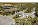 A gated entrance with decorative pillars and lush landscaping welcomes you to this beautiful community at 11125 Mcdermott Ct, Englewood, FL 34223