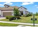 Lovely single-story home with a tile roof, two-car garage, and attractive landscaping at 11125 Mcdermott Ct, Englewood, FL 34223