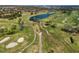 Expansive golf course featuring lush greenery, sand traps, and a scenic lake winding through the community at 11125 Mcdermott Ct, Englewood, FL 34223