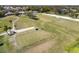 A well-maintained golf course with a clear blue sky overhead, perfect for a relaxing day of golfing at 11125 Mcdermott Ct, Englewood, FL 34223