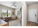 Cozy office space with a ceiling fan and bright natural lighting at 11125 Mcdermott Ct, Englewood, FL 34223