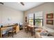 Comfortable home office with natural light and a neutral color scheme at 11125 Mcdermott Ct, Englewood, FL 34223