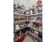Organized walk-in pantry featuring multiple shelves and ample storage for all your essentials at 11125 Mcdermott Ct, Englewood, FL 34223