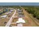 Aerial view of a single Gathering home with a fenced-in yard, adjacent to green space and other homes at 113 Annapolis Ln, Rotonda West, FL 33947