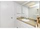Bathroom with vanity, large mirror, and white walls and accents at 113 Annapolis Ln, Rotonda West, FL 33947