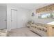 Bedroom with white walls, window, bed, standard closet with sliding doors at 113 Annapolis Ln, Rotonda West, FL 33947