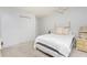 Bedroom with white bedding, neutral walls, and standard closet with sliding doors at 113 Annapolis Ln, Rotonda West, FL 33947