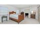 Bright bedroom with a ceiling fan, natural light, and a lovely wooden bed frame at 113 Annapolis Ln, Rotonda West, FL 33947