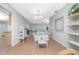 Bright dining area with glass table, lots of seating, and great view into the living room at 113 Annapolis Ln, Rotonda West, FL 33947