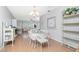 Bright dining area featuring a glass table, wicker furniture and a large window offering plenty of natural light at 113 Annapolis Ln, Rotonda West, FL 33947