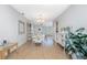 Inviting dining room with neutral decor, light wood floors and seamless flow into the living spaces at 113 Annapolis Ln, Rotonda West, FL 33947