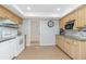Traditional kitchen with tile flooring, standard white appliances, and wood cabinets with granite countertops at 113 Annapolis Ln, Rotonda West, FL 33947
