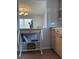 Cozy kitchen area with decorative shelf, tile backsplash and wood cabinets at 113 Annapolis Ln, Rotonda West, FL 33947