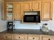 Kitchen with wood cabinets, granite countertops, stainless steel appliances and modern fixtures at 113 Annapolis Ln, Rotonda West, FL 33947