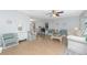 Bright living room featuring coastal decor, neutral walls and ceiling fan at 113 Annapolis Ln, Rotonda West, FL 33947