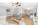 Spacious living room featuring modern decor, comfortable seating arrangements, and wood flooring at 113 Annapolis Ln, Rotonda West, FL 33947
