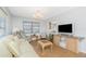 Relaxing living room with plush seating, bright lighting, and neutral décor, creating a cozy atmosphere at 113 Annapolis Ln, Rotonda West, FL 33947