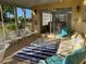 Spacious sunroom with a variety of seating options and a view to the outdoors at 113 Annapolis Ln, Rotonda West, FL 33947