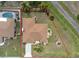 A top-down aerial view depicts the property's boundaries and landscaping within a residential area at 1155 Osceola Blvd, Englewood, FL 34223