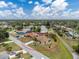 An aerial perspective highlights the home's location within a peaceful, tree-lined neighborhood at 1155 Osceola Blvd, Englewood, FL 34223