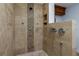 Close up of a shower with a shower head and decorative accents at 1155 Osceola Blvd, Englewood, FL 34223