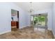 Open-concept dining room featuring tiled floors, modern lighting, and outdoor views at 1155 Osceola Blvd, Englewood, FL 34223