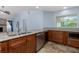 Well-equipped kitchen with granite countertops, stainless steel appliances, and custom cabinets at 1155 Osceola Blvd, Englewood, FL 34223