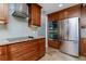 Well-appointed kitchen with stainless steel appliances, granite countertops, and custom cabinetry at 1155 Osceola Blvd, Englewood, FL 34223