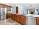 Open kitchen with granite countertops, stainless steel appliances, and ample cabinet space at 1155 Osceola Blvd, Englewood, FL 34223