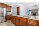 Beautiful kitchen featuring granite countertops, stainless steel appliances, and travertine tile flooring at 1155 Osceola Blvd, Englewood, FL 34223