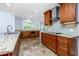 Well-equipped kitchen with granite countertops, stainless steel appliances, and custom cabinets at 1155 Osceola Blvd, Englewood, FL 34223