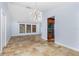 Open-concept living room featuring tiled floors, modern lighting, and neutral paint at 1155 Osceola Blvd, Englewood, FL 34223
