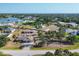 Neighborhood with waterfront views, mature landscaping, and various home styles at 11869 Newgate Ave, Port Charlotte, FL 33981