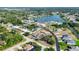 Residential neighborhood with waterfront views, mature landscaping, and various home styles at 11869 Newgate Ave, Port Charlotte, FL 33981