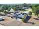 Aerial view of a home with solar panels and a screened lanai at 11869 Newgate Ave, Port Charlotte, FL 33981