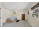 Cozy bedroom with a twin bed, ceiling fan, and a window providing natural light at 11869 Newgate Ave, Port Charlotte, FL 33981