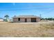 Charming one-story home featuring a well-maintained lawn, neutral exterior paint, and an attached garage at 11869 Newgate Ave, Port Charlotte, FL 33981