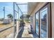 Covered patio with screened-in enclosure offers outdoor seating and relaxing view at 11869 Newgate Ave, Port Charlotte, FL 33981