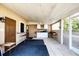 Enclosed patio with a ceiling fan, built-in bar, and ample seating space at 11869 Newgate Ave, Port Charlotte, FL 33981