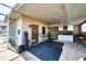 Enclosed patio featuring a built-in bar, ample seating, and access to the outdoors at 11869 Newgate Ave, Port Charlotte, FL 33981