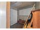 A room with a pegboard wall with a piano and some wood at 11869 Newgate Ave, Port Charlotte, FL 33981