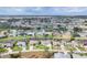Extensive aerial view of a canal community with well-maintained lawns, single-Gathering homes and mature landscaping at 119 Fairway Rd, Rotonda West, FL 33947