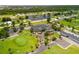 An aerial view showing the clubhouse, golf course, waterways, and residential area of the beautiful golf community at 119 Fairway Rd, Rotonda West, FL 33947